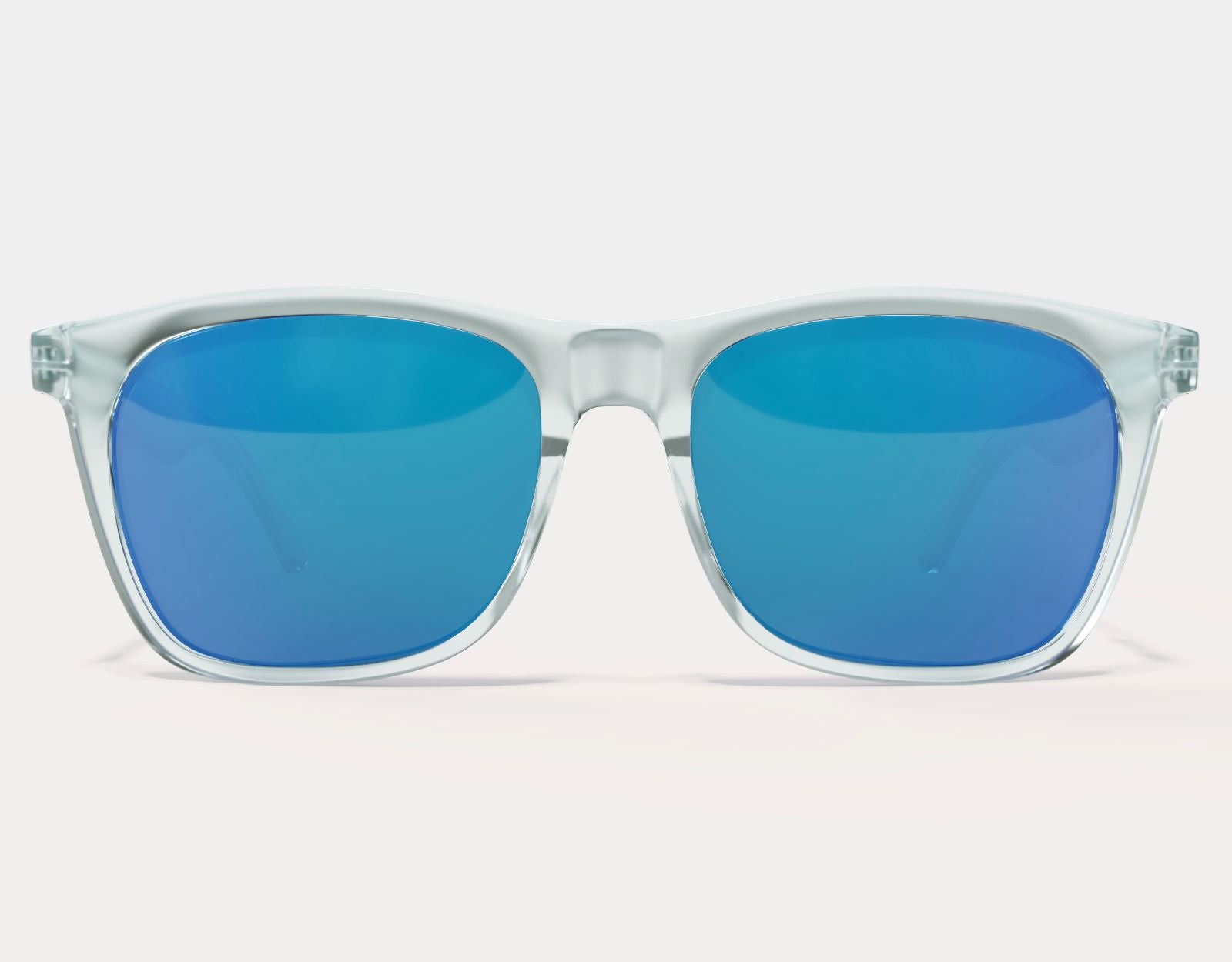 Model wearing Classic 155mm XL sunglasses in Clear with blue ice lenses – bold look with wide fit for large heads.