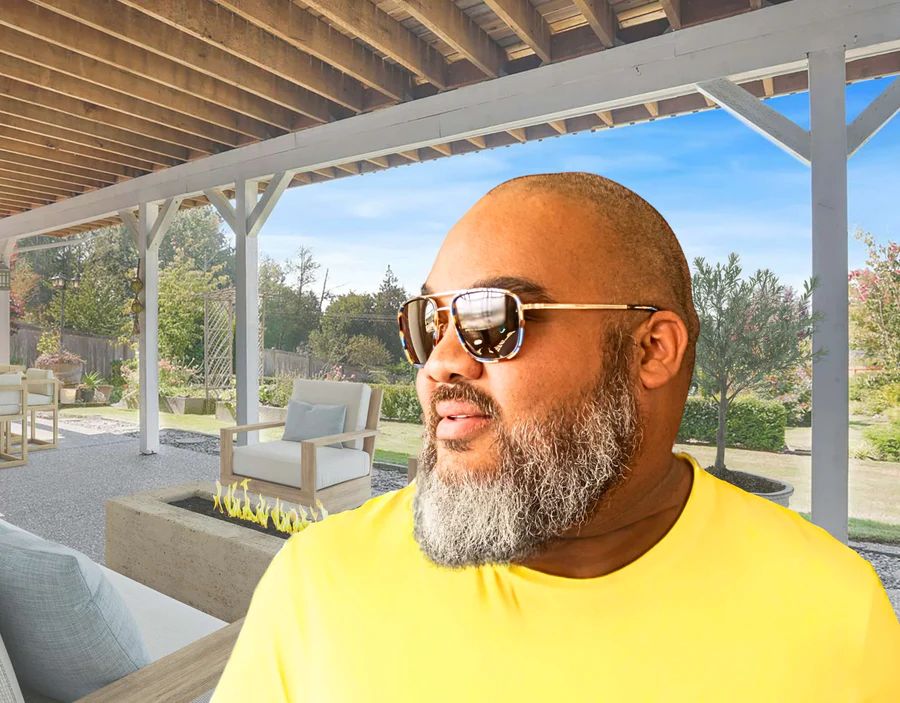 Model wearing The Arrival 165mm XXL big head sunglasses in Atlantic with brown polarised lenses – modern aviator-style design for wide faces.