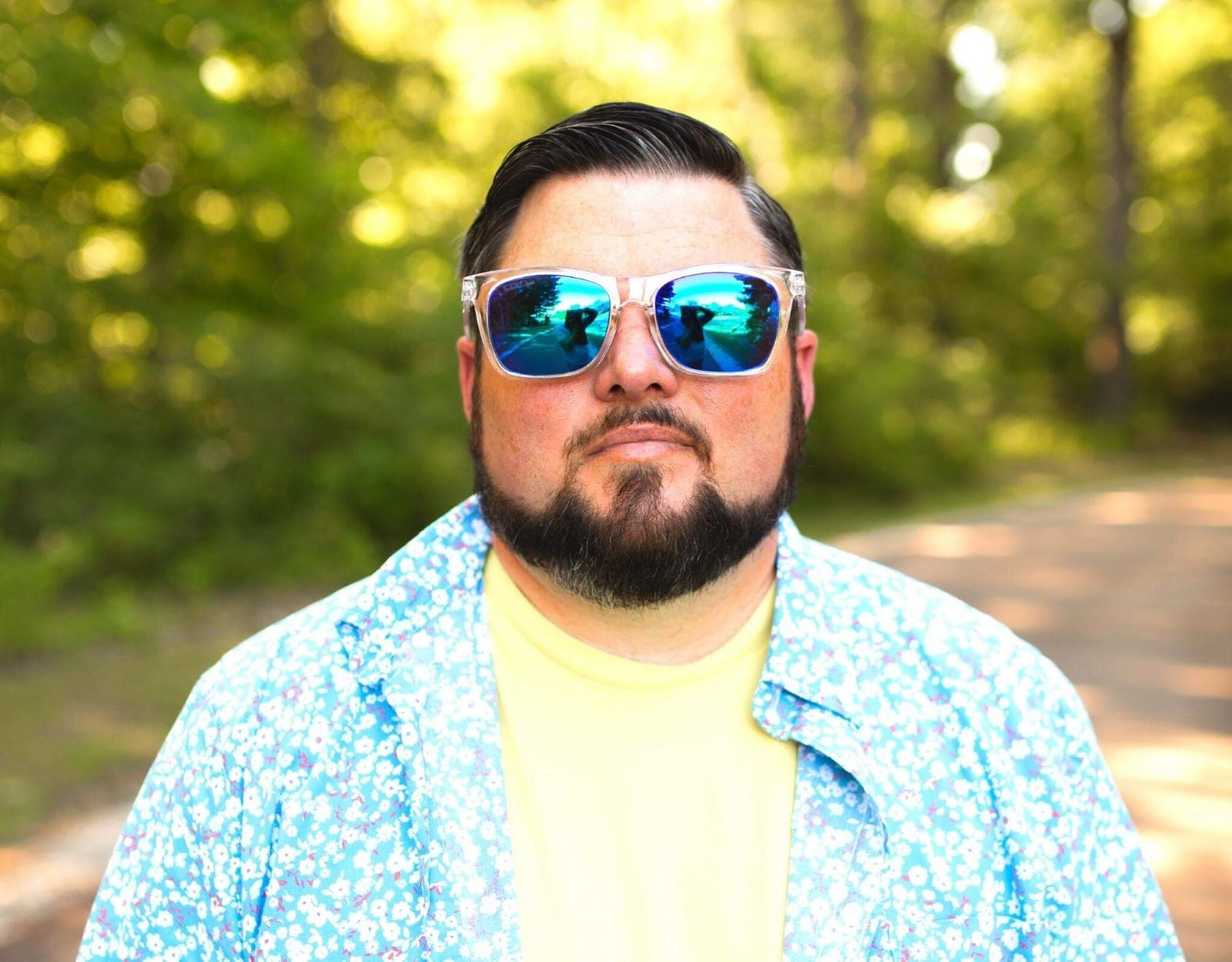 Model wearing Classic 165mm XXL polarised sunglasses for big heads in Clear – oversized fit and frosted lens colour combo.