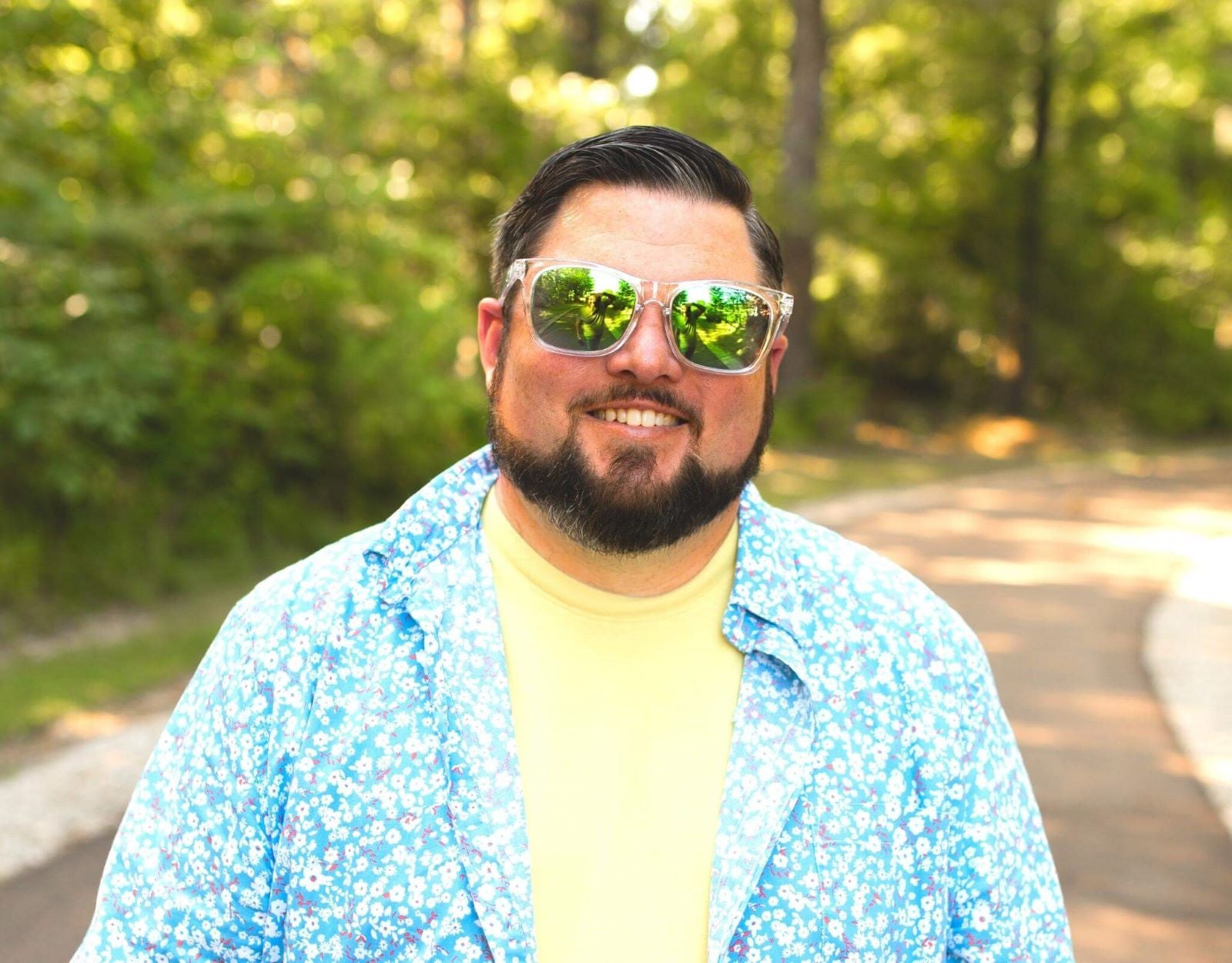 Model wearing Classic 165mm XXL large head sunglasses in Clear with green polarised lenses – oversized comfort with bold green lenses.