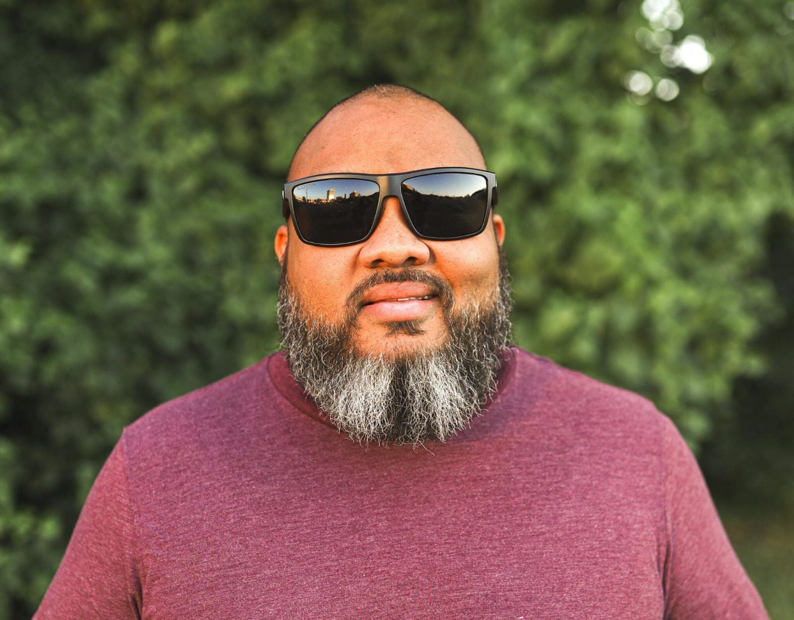 Model wearing Sport 165mm XXL extra wide sport sunglasses in blackout style – polarised lenses and ultra-secure fit.