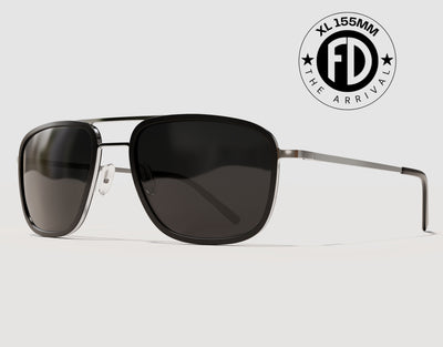 The Arrival 155mm XL premium aviator-style sunglasses in Black and Chrome with black smoke polarised lenses – lightweight wide-fit frame with adjustable nose pads.
