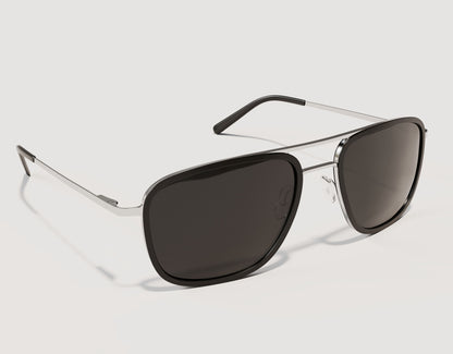 Side profile of The Arrival 155mm XL aviator-style sunglasses in Black and Chrome showing lightweight hybrid construction and spring hinges.