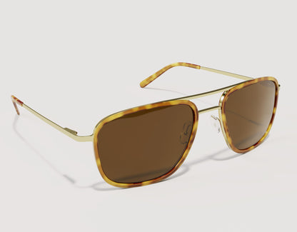 Side angle of The Arrival 155mm XL sunglasses in Tortoise and Gold showing lightweight hybrid metal and acetate construction.