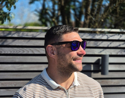 Model wearing Classic 155mm XL extra wide sunglasses with blue ice lenses – cool tone and oversized fit for big heads.