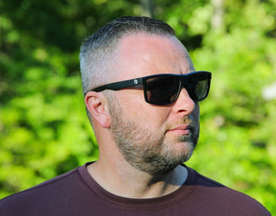 Model wearing Sport 155mm XL sunglasses in Black Mat – polarised sport shades designed for round faces and large heads.
