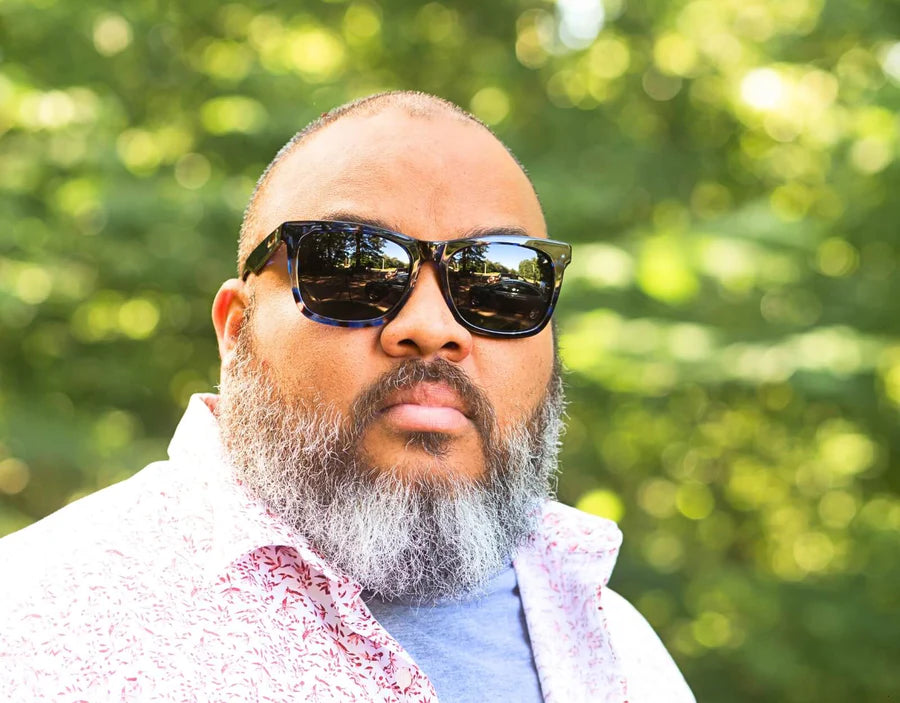 Model wearing Classic Pro 165mm XXL sunglasses for big heads in Atlantic with black polarised lenses – durable wide-fit frame built for everyday wear.