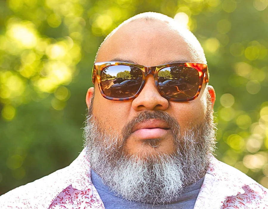 Model wearing Classic Pro 165mm XXL sunglasses for big heads in Tortoise with brown polarised lenses – stylish wide fit with durable construction.