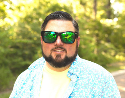 Model wearing Classic 165mm XXL polarised sunglasses for big heads in Black– large fit and bright lens colour combo.